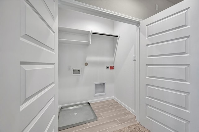 clothes washing area featuring electric dryer hookup, hookup for a washing machine, and gas dryer hookup