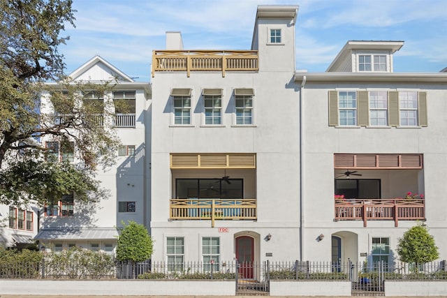 view of front of home featuring a balcony