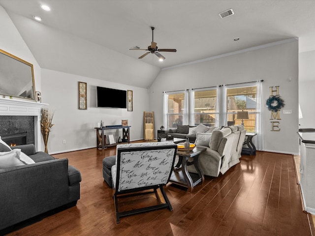 living room featuring ornamental molding, ceiling fan, a fireplace, dark hardwood / wood-style floors, and lofted ceiling