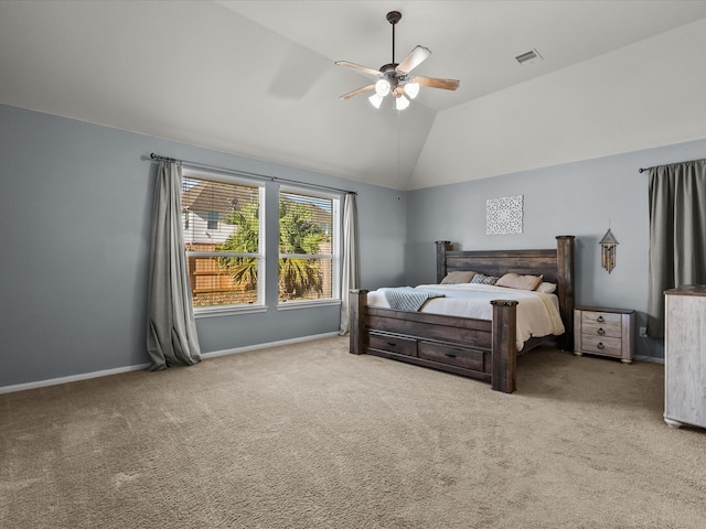 carpeted bedroom featuring ceiling fan and vaulted ceiling