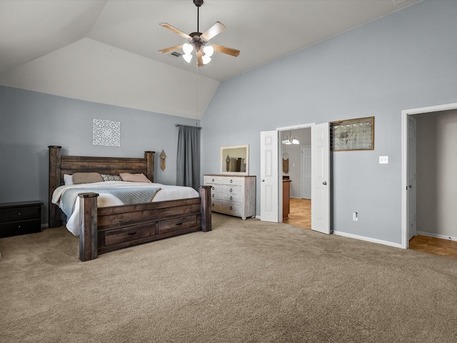 bedroom featuring ceiling fan, light colored carpet, and vaulted ceiling