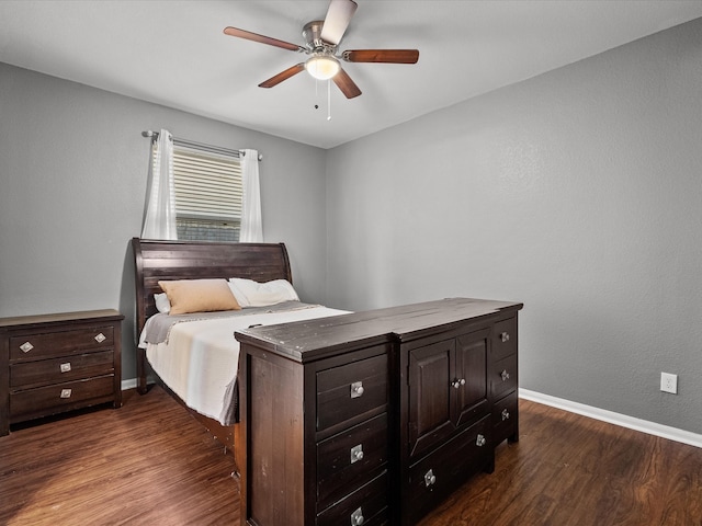 bedroom with ceiling fan and dark hardwood / wood-style floors