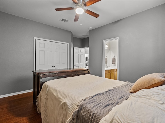 bedroom featuring connected bathroom, ceiling fan, and dark hardwood / wood-style flooring