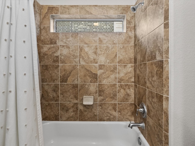 bathroom with shower / tub combo with curtain