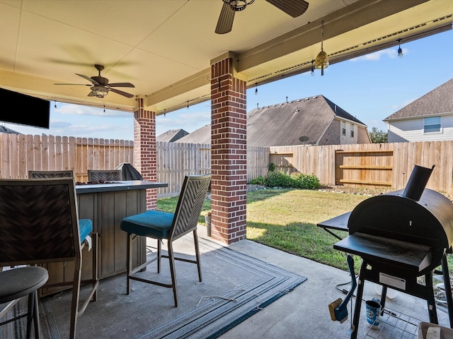 view of patio / terrace with exterior bar and grilling area