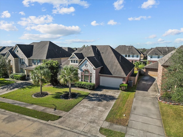 view of front of home featuring a front yard and a garage