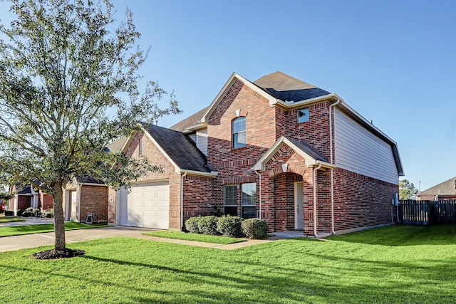 view of property with a front yard and a garage