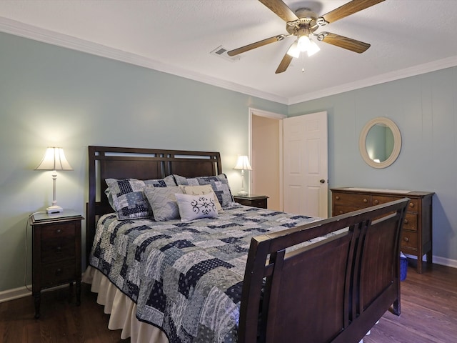 bedroom featuring crown molding, dark hardwood / wood-style floors, and ceiling fan