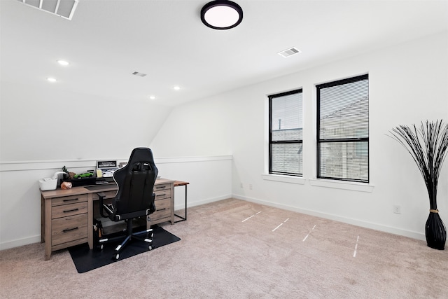 office featuring lofted ceiling and light colored carpet