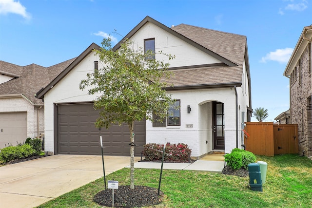 view of front facade with a front lawn and a garage