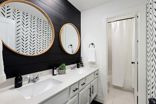 full bathroom with toilet, tile patterned flooring, wooden walls, shower / tub combo, and vanity