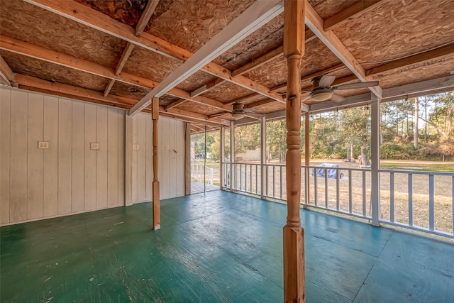 unfurnished sunroom featuring ceiling fan