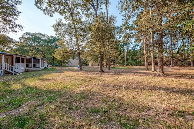 view of yard with a sunroom