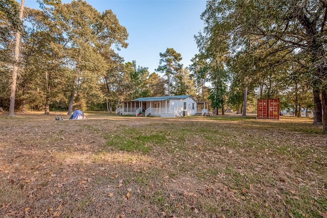 view of yard with a sunroom