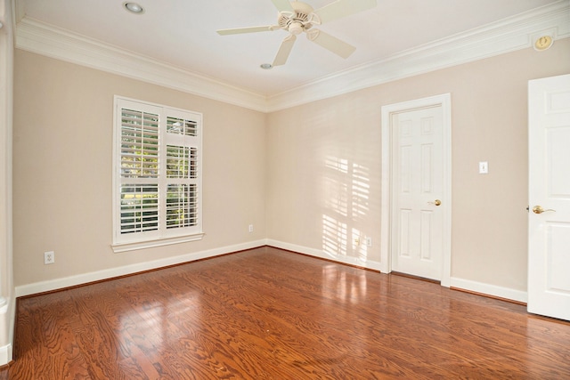 empty room featuring hardwood / wood-style floors, ornamental molding, and ceiling fan