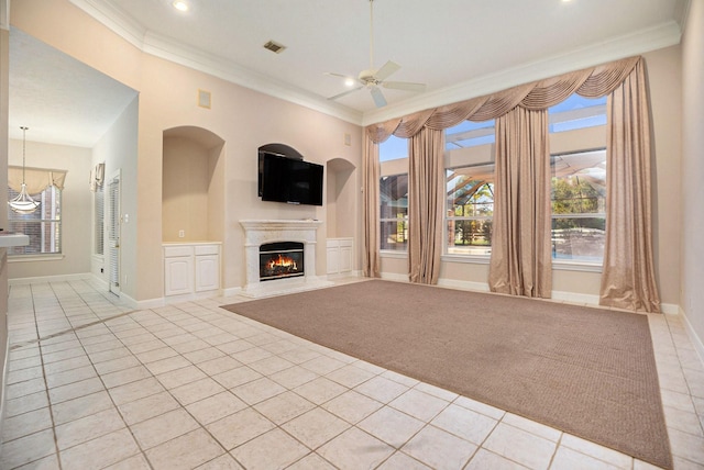 unfurnished living room with ceiling fan, crown molding, and light carpet