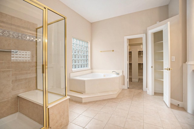 bathroom with tile patterned flooring and independent shower and bath