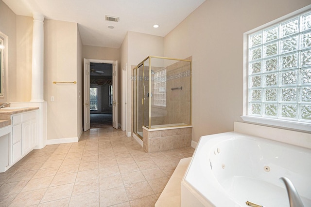 bathroom featuring plus walk in shower, tile patterned floors, and vanity