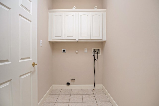 clothes washing area with gas dryer hookup, hookup for a washing machine, cabinets, and hookup for an electric dryer