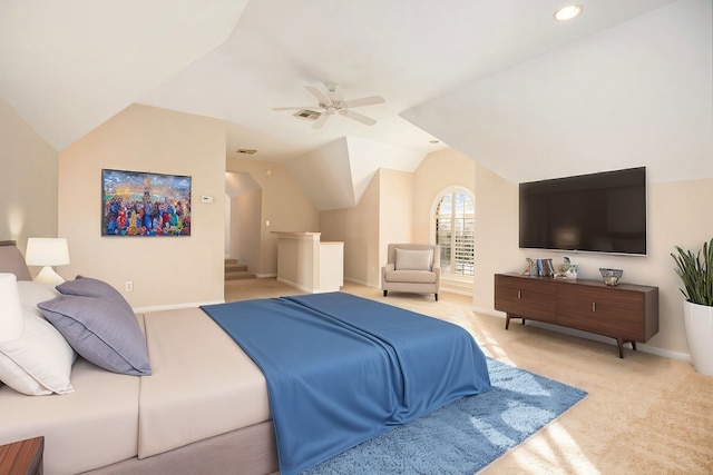 bedroom featuring lofted ceiling, ceiling fan, and light colored carpet