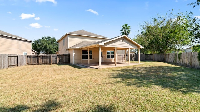 2038 Adobe Stone Dr, Humble, TX 77396 - back of property with a lawn, a patio area, and a fenced backyard
