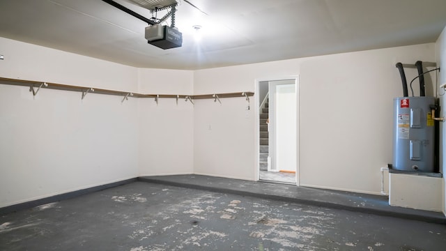 garage featuring a garage door opener and electric water heater