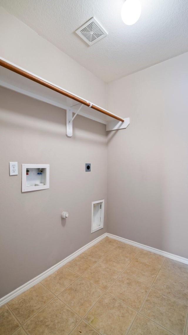 2038 Adobe Stone Dr, Humble, TX 77396 - laundry room featuring laundry area, hookup for an electric dryer, visible vents, light tile patterned floors, and hookup for a washing machine