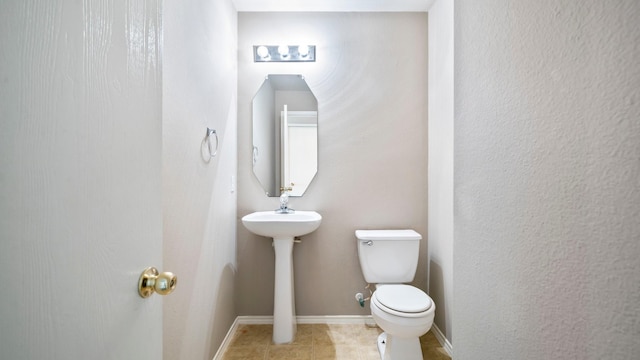 2038 Adobe Stone Dr, Humble, TX 77396 - bathroom with toilet, tile patterned flooring, and baseboards