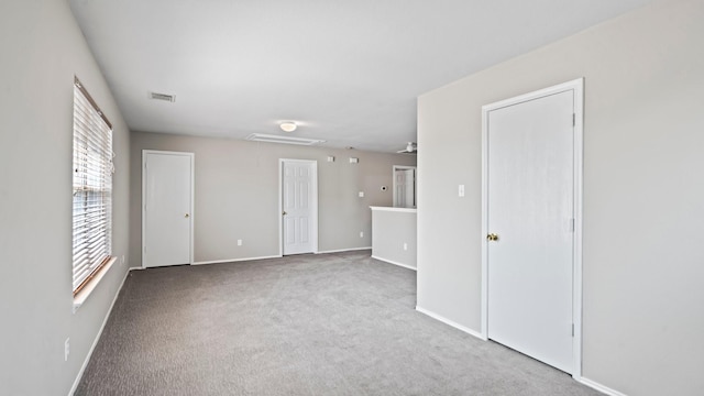 2038 Adobe Stone Dr, Humble, TX 77396 - carpeted empty room with attic access, baseboards, and visible vents