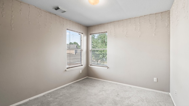 unfurnished room with carpet flooring