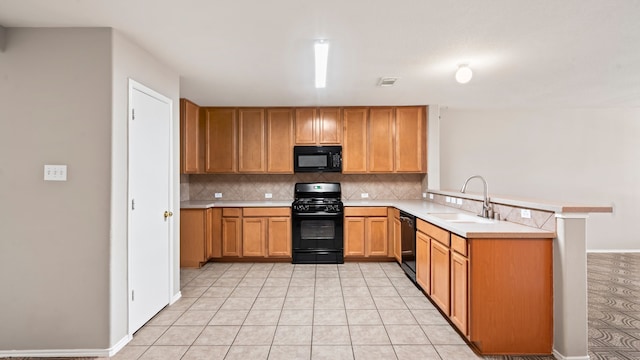 kitchen with kitchen peninsula, backsplash, sink, black appliances, and light tile patterned flooring