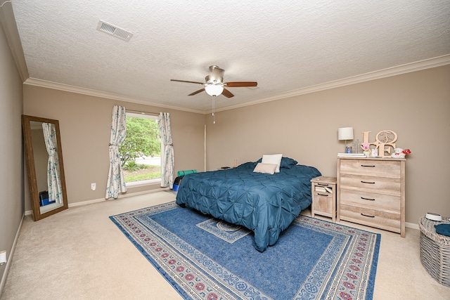 carpeted bedroom featuring crown molding, a textured ceiling, and ceiling fan