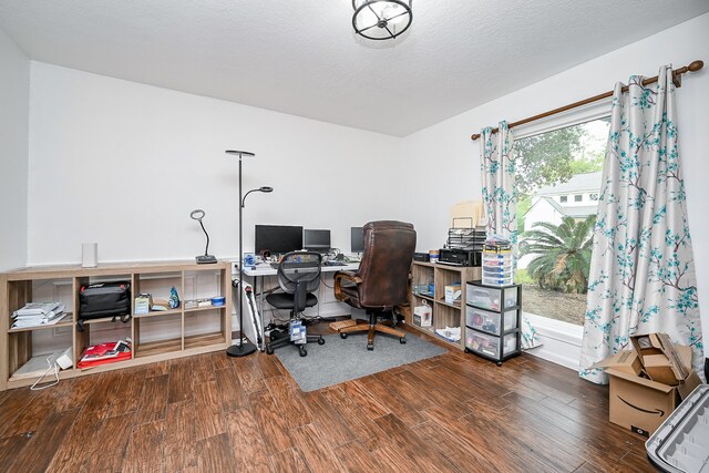 office featuring hardwood / wood-style floors and a textured ceiling