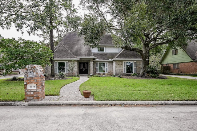 view of front of property with a front lawn