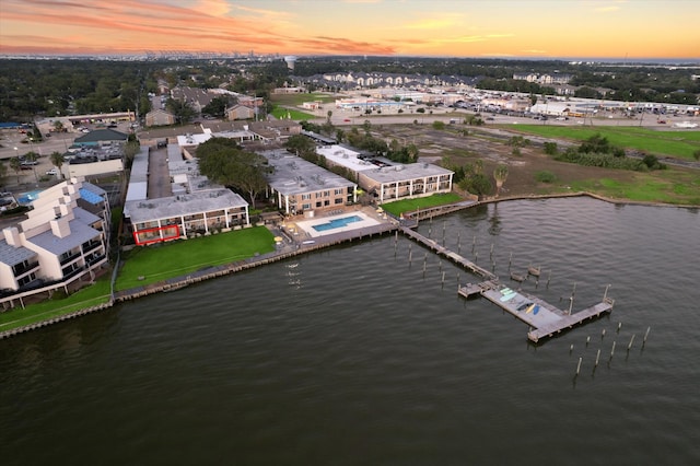 aerial view at dusk with a water view