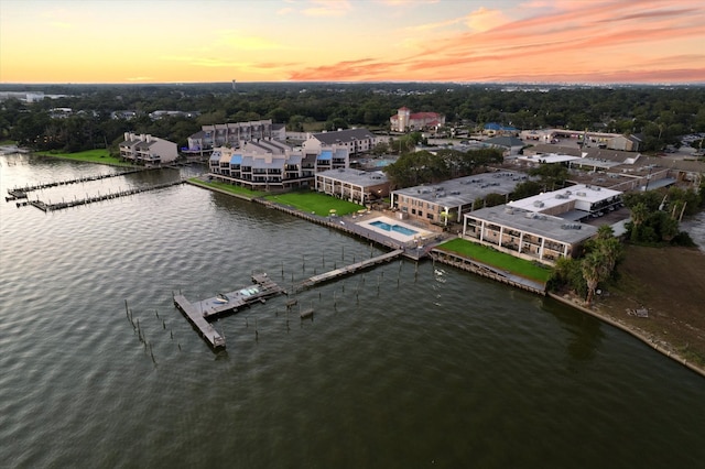 aerial view at dusk with a water view