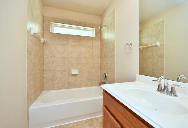 bathroom featuring vanity and tiled shower / bath combo