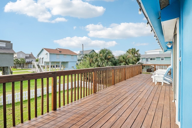 wooden terrace with a yard