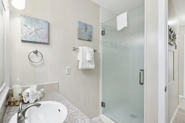 bathroom featuring vanity, tile patterned floors, and an enclosed shower