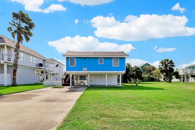 back of property featuring a lawn