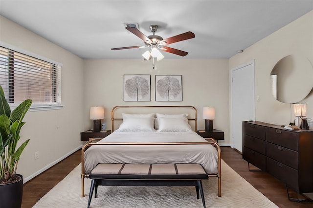 bedroom featuring dark hardwood / wood-style flooring and ceiling fan