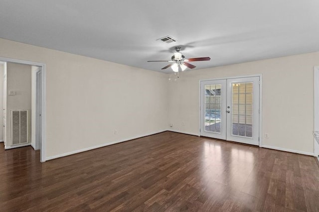 unfurnished room featuring french doors, ceiling fan, and dark hardwood / wood-style flooring