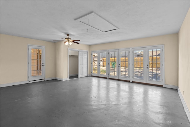 spare room with french doors, a textured ceiling, and ceiling fan