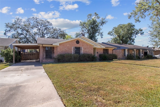 ranch-style house featuring a front yard and a carport