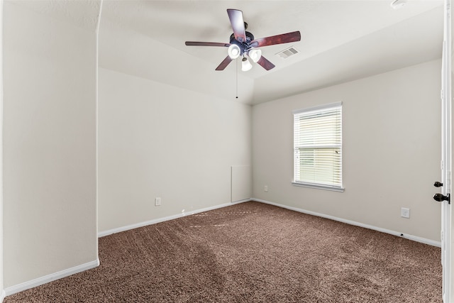 spare room featuring carpet floors and ceiling fan