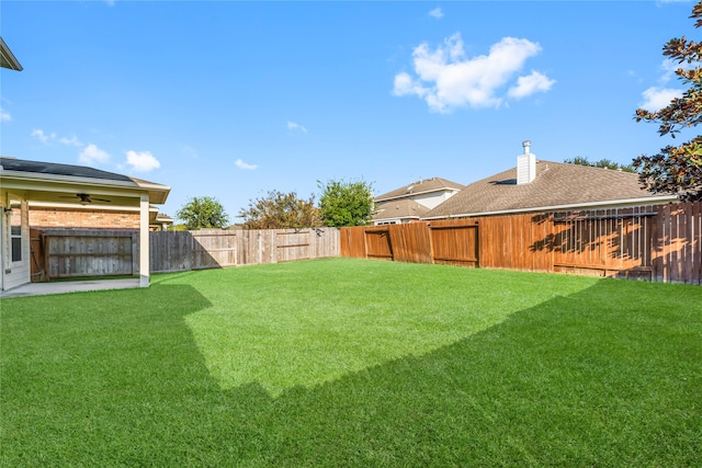 view of yard featuring ceiling fan