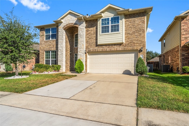 view of front of home with central AC, a garage, and a front lawn