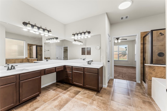 bathroom with vanity, plus walk in shower, tile patterned floors, and ceiling fan