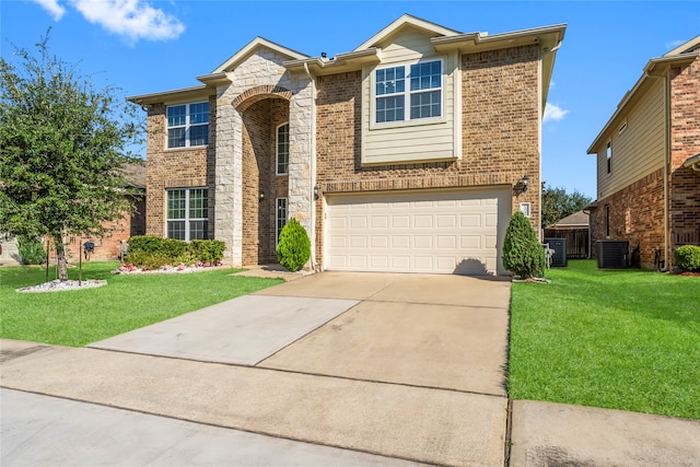 view of front of house with a garage, a front lawn, and central AC unit