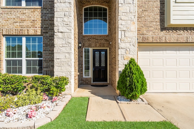 property entrance with a garage